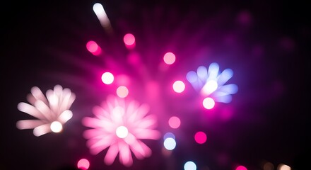 Blurred fireworks explode in vibrant colors against the night sky