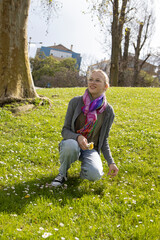 Fototapeta premium Young woman enjoying nature in a sunny park