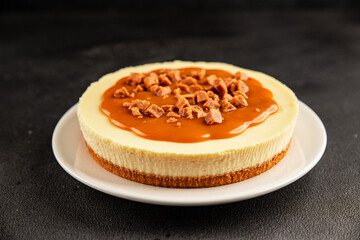 Cheesecake salted caramel sweet dessert fresh delicious gourmet food background on the table rustic food top view copy space