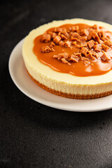 Cheesecake salted caramel sweet dessert fresh delicious gourmet food background on the table rustic food top view copy space