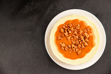 Cheesecake salted caramel sweet dessert fresh delicious gourmet food background on the table rustic food top view copy space