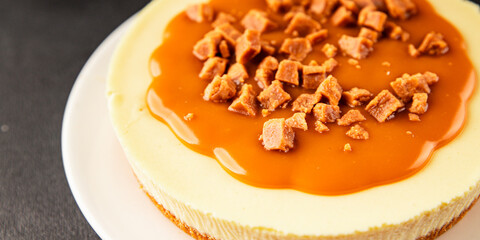 Cheesecake salted caramel sweet dessert fresh delicious gourmet food background on the table rustic food top view copy space