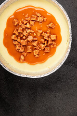 Cheesecake salted caramel sweet dessert fresh delicious gourmet food background on the table rustic food top view copy space
