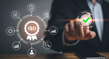 Obraz premium Man approves ISO certification, ensuring business quality with digital checkmark