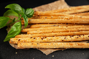 Grissini breadsticks whole grain cereal fresh delicious gourmet food background on the table rustic food top view copy space