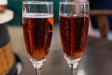 Pouring and tasting of rose or pink cuvee sparkling wine brut, grand reserve, champagne in Ay-Champagne wine making village in Vallee de la Marne, , Champagne region, France