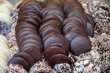 Famous Belgian chocolate candies on display in confectionery shop in Bruges, Belgium