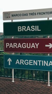 Vertical video close-up of the tri-border area between Brazil, Argentina, and Paraguay