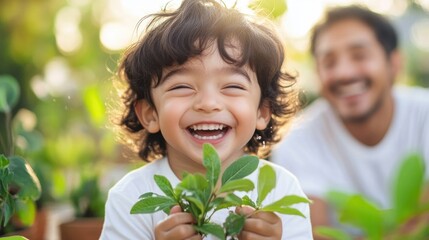 Little boy joyfully spraying water on plants in sunny garden for family gardening fun and nature exploration