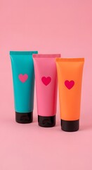Fototapeta premium Colorful tubes of lotion with hearts on a pink background perfect for valentines day and beauty projects showcasing skin care and self care