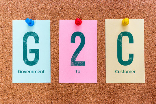 Conceptual 3 letters keyword G2C (Government to Customer), on multicolored stickers attached to a cork board.