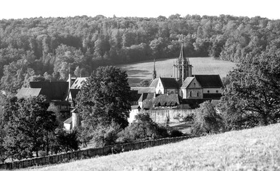 Panoramic view of the monastery and castle complex in Bebenhausen near Tübingen (Germany). Historic ensemble of buildings. The monument is a popular tourist destination. Black and white vintage photo.
