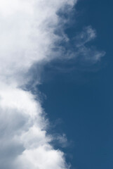 Obraz premium Soft clouds float across a vast, overcast sky. 
