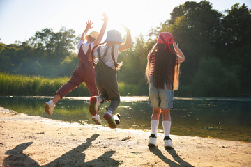 Obraz premium Cute little girls spending time in nature on sunny day