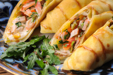 pancakes with filling wrapped in rolls macro photo