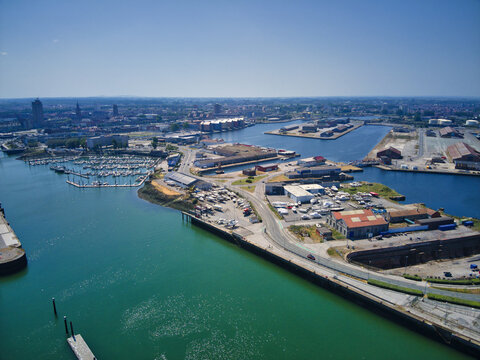 Aerial view of the port where the city meets the sea, a tapestry of blue waters, contrasted by the urban landscape, Dunkirk, Nord, France.