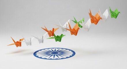 Origami paper cranes in Indian flag colors flying over the Ashoka Chakra symbol