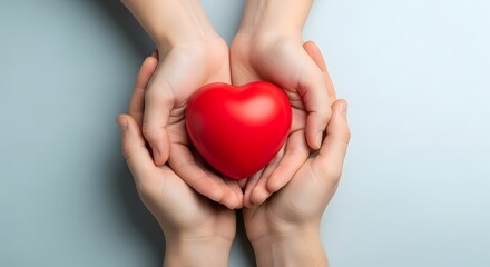 Obraz premium Heart in hands concept for love, care, health, donation, support, charity, and valentine's day