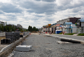 Road repairs on Sovetskaya Street in the city of Noyabrsk in the summerRoad repairs on Sovetskaya Street in the city of Noyabrsk in the summer