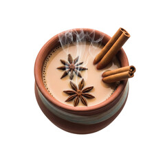 Delicious hot chai tea in a rustic clay cup garnished with star anise and cinnamon sticks isolated on transparent background