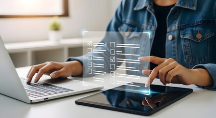 Woman completing digital checklist survey form online using laptop and tablet technology today