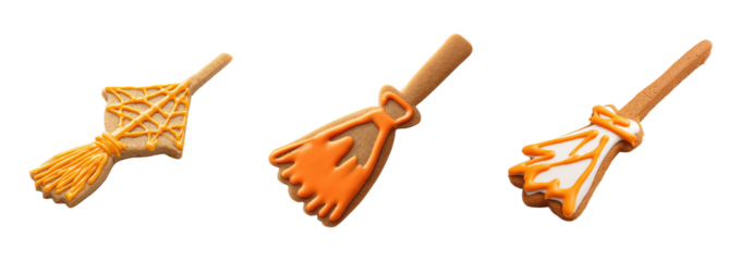 Halloween dessert cookies shaped like broomsticks with orange icing decoration on transparency background