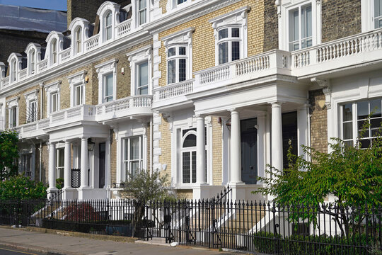 Long row of yellow brick townhouses in central London