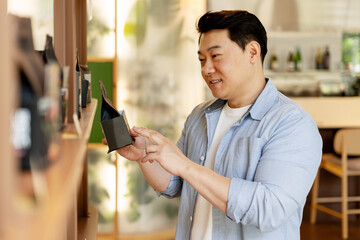 Customer choosing coffee beans in grocery store
