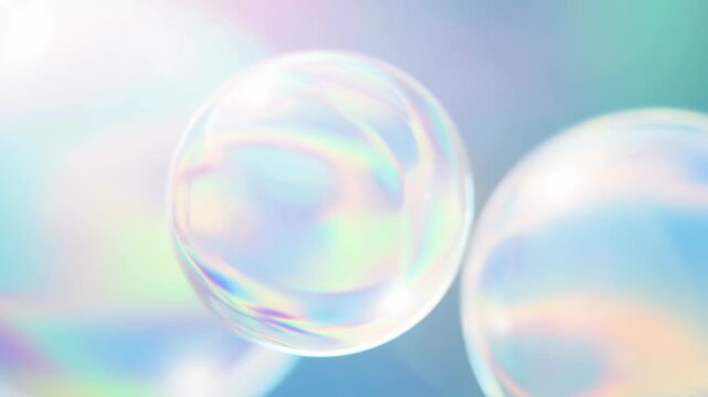 Floating translucent bubbles changing color in a soft gradient mist - dreamy motion.
