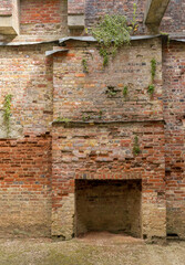 Fireplace and chimney stack in the empty building shell of Appuldurcombe House near Wroxall on the Isle of Wight