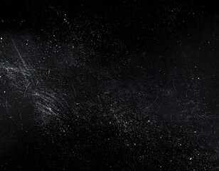 Obraz premium Dark background with scattered light dust particles
