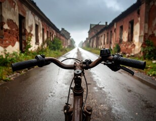 Old bicycle riding through abandoned town after rain
