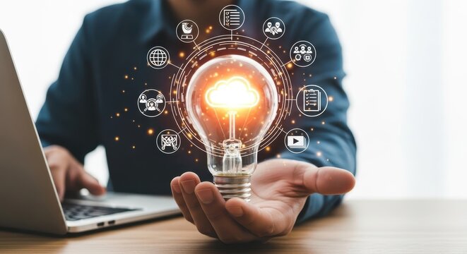 Man holding a lightbulb with digital icons around it - Powered by Adobe