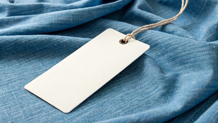 Blank white tag mockup on blue fabric background for product branding and price tag design concept hd wallpaper, wallpaper 4k