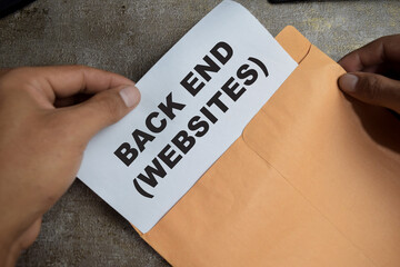 Back end websites text above brown envelope programming of internet website isolated on wooden background. Coding cyberspace concept
