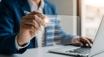 Professional in blue suit using digital checklist on laptop, concept of success, task completion, and project management