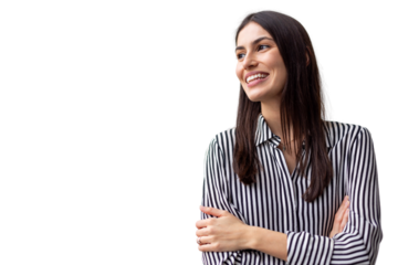 Confident businesswoman standing with crossed arms, projecting professional demeanor in studio setting against clean white backdrop