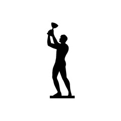 A man holding a trophy silhouette.