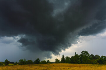 Dramatic storm clouds in the sky, dark severe storm clouds, supercell.