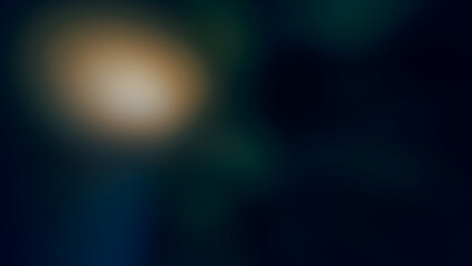 Obraz premium Abstract soft blurred dark background with subtle golden light and deep blue tones creating a moody atmospheric effect