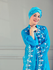 Young woman in oriental blue dress. Eastern dance.