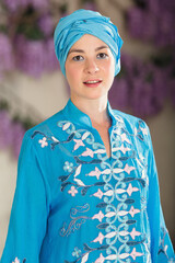 Portrait young woman in oriental blue dress. Eastern dance.