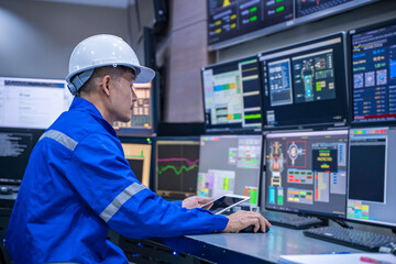 Engineer working at control room, Manager control system, Technician man monitoring program from a lot of monitor.Specialist observes analytics dashboard,operator inspects digital interface