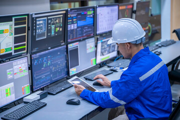 Engineer working at control room, Manager control system, Technician man monitoring program from a lot of monitor.Specialist observes analytics dashboard,operator inspects digital interface