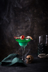 Spooky green Halloween cocktail with eyeball