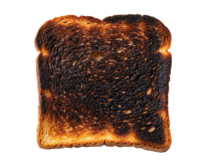 A single slice of burnt toast is isolated against a plain transparent background