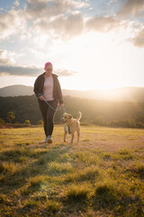 Woman walking with her dog
