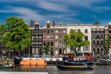Details and facades of Amsterdam characteristic brick construction of residential building in Amsterdam School style. High quality photo