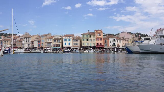 Cassis France Harbor with Beautiful Colorful Buildings on a Summer Day Wide View. Boats in the Port Tied at the Dock, European Holiday