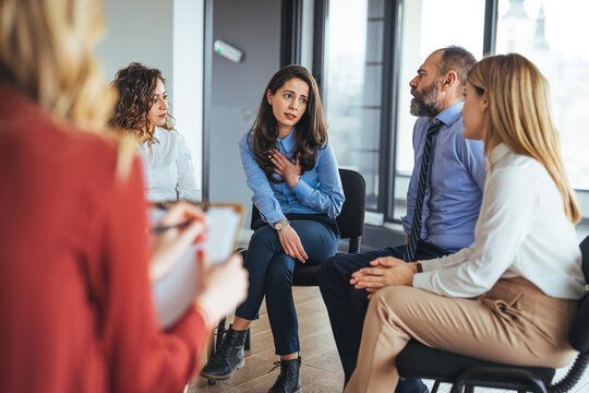 Group Therapy Session with Diverse Participants Sharing and Emphasizing Communication